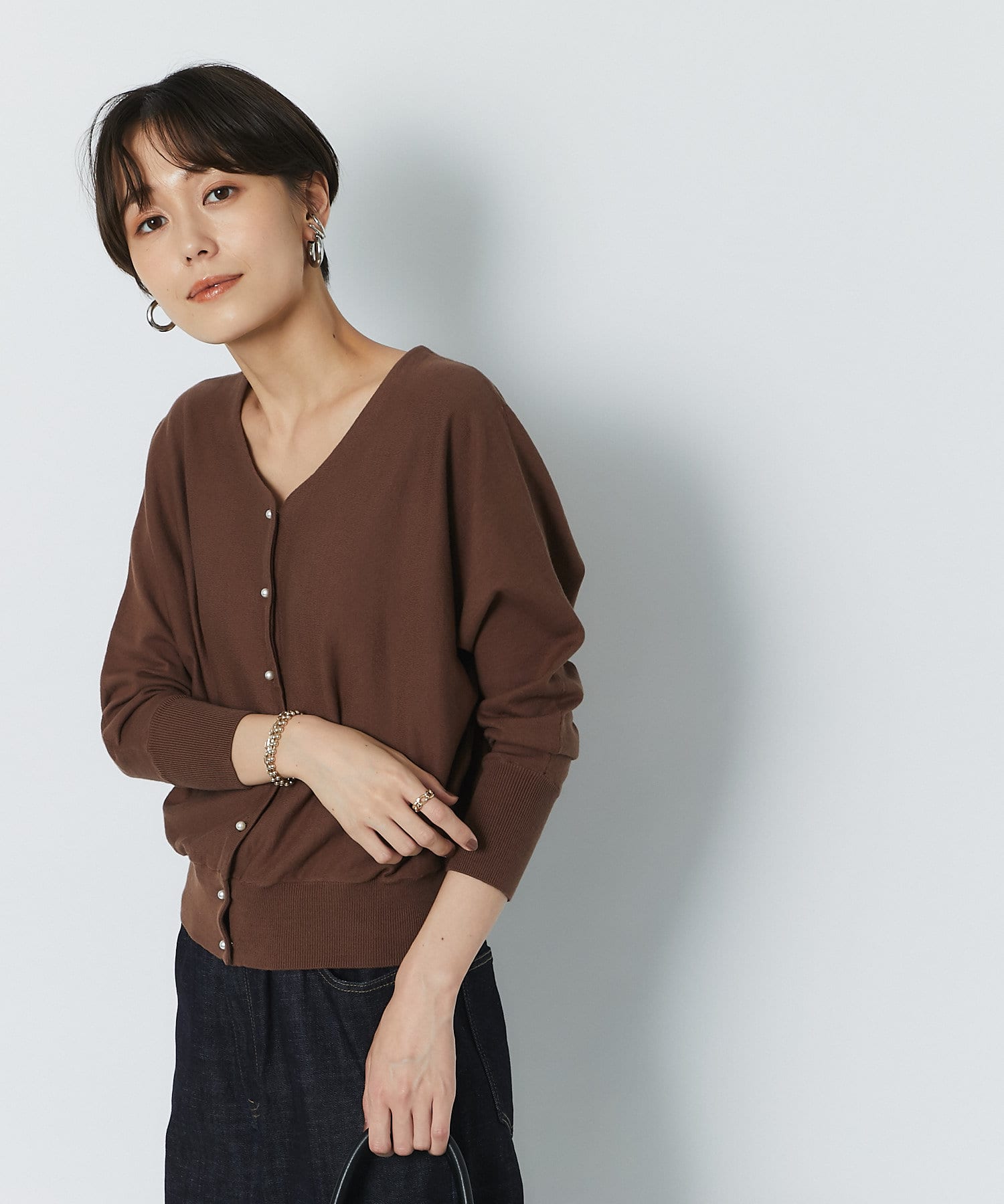 un dix cors(アンディコール) 【春先まで使える】2wayパール釦カーディガン