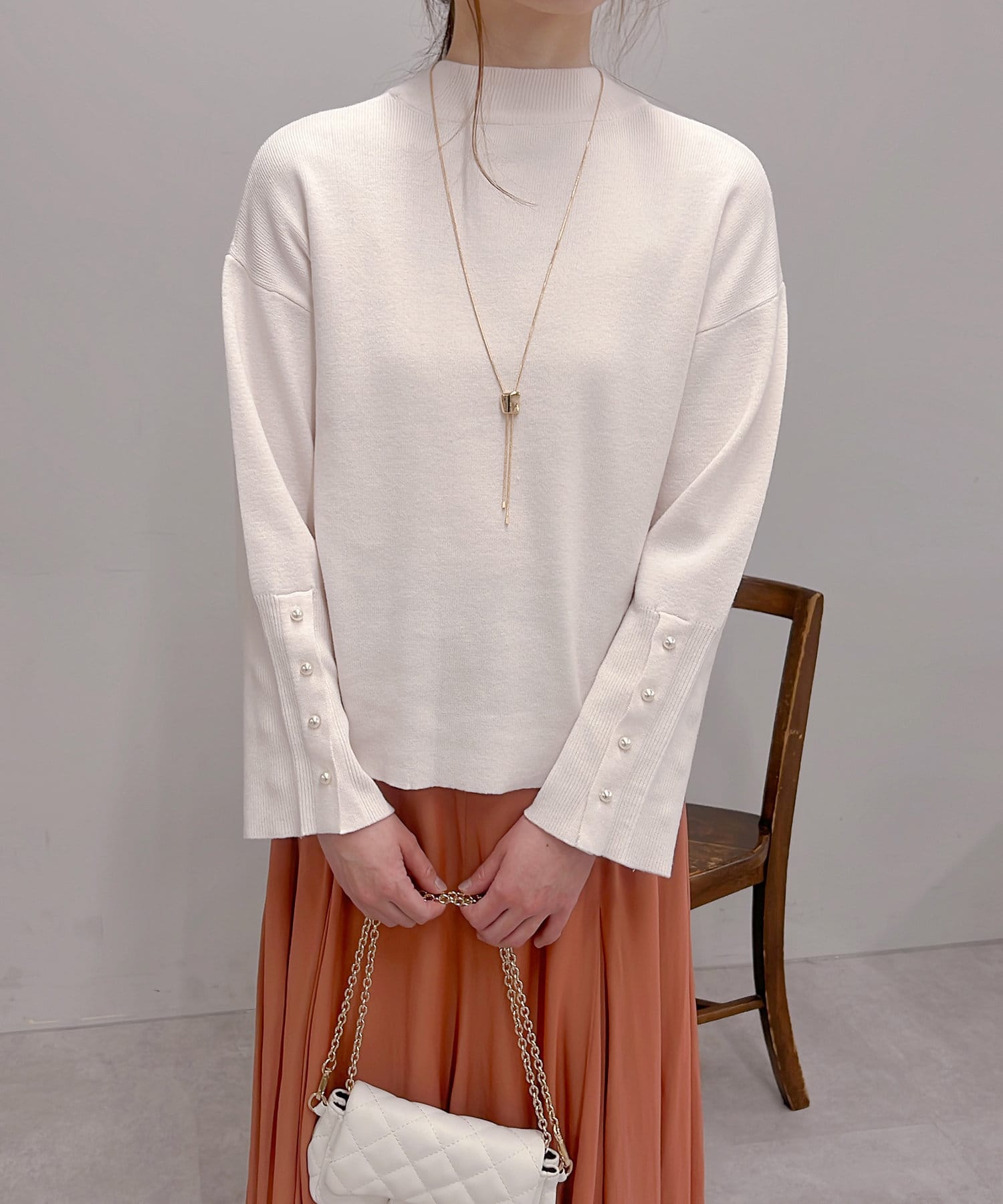 un dix cors(アンディコール) 【ベーシックに着回せる】袖スリットパール釦ニット