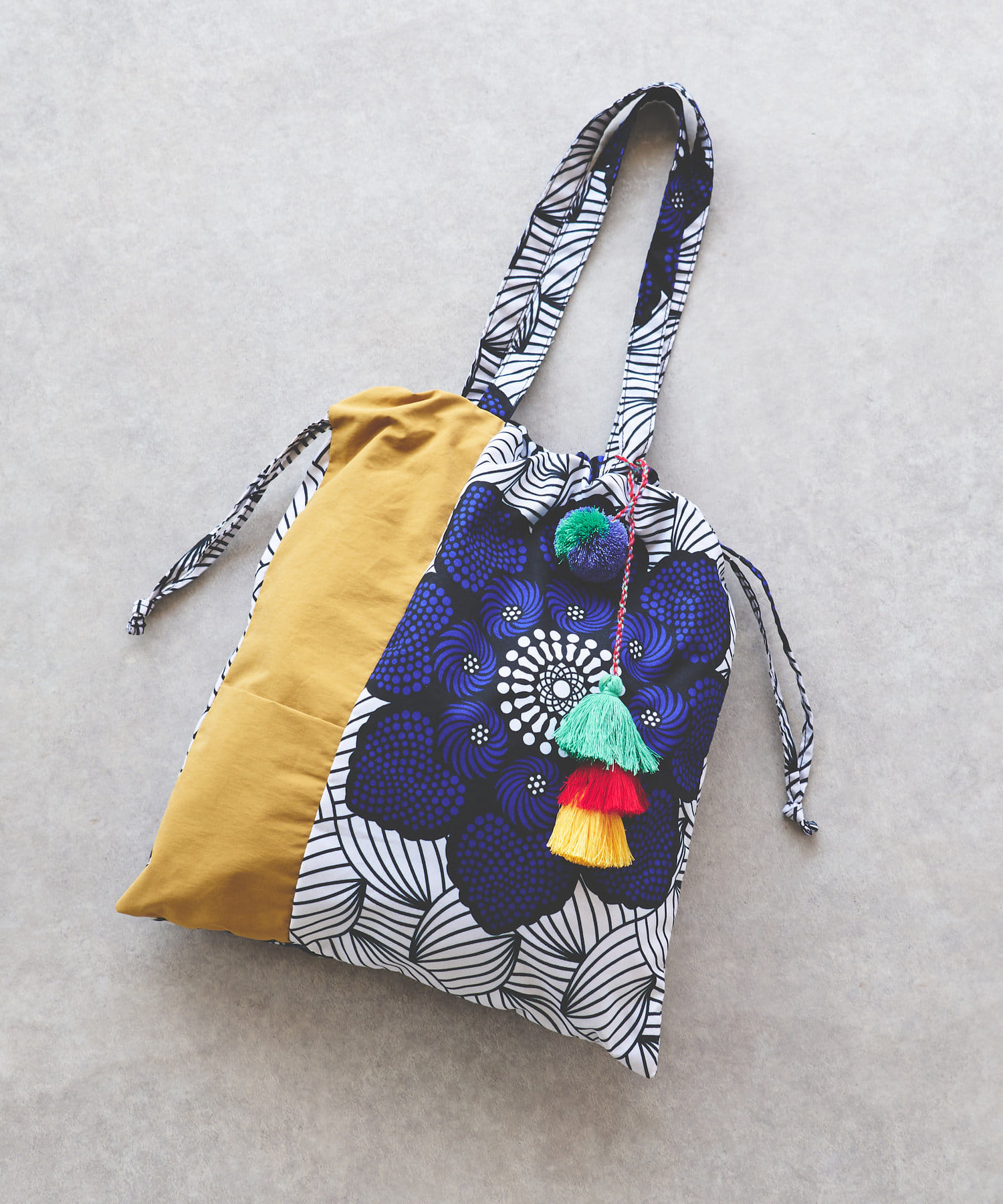 un dix cors(アンディコール) 《予約》アフリカン柄タッセル２WAYバッグ