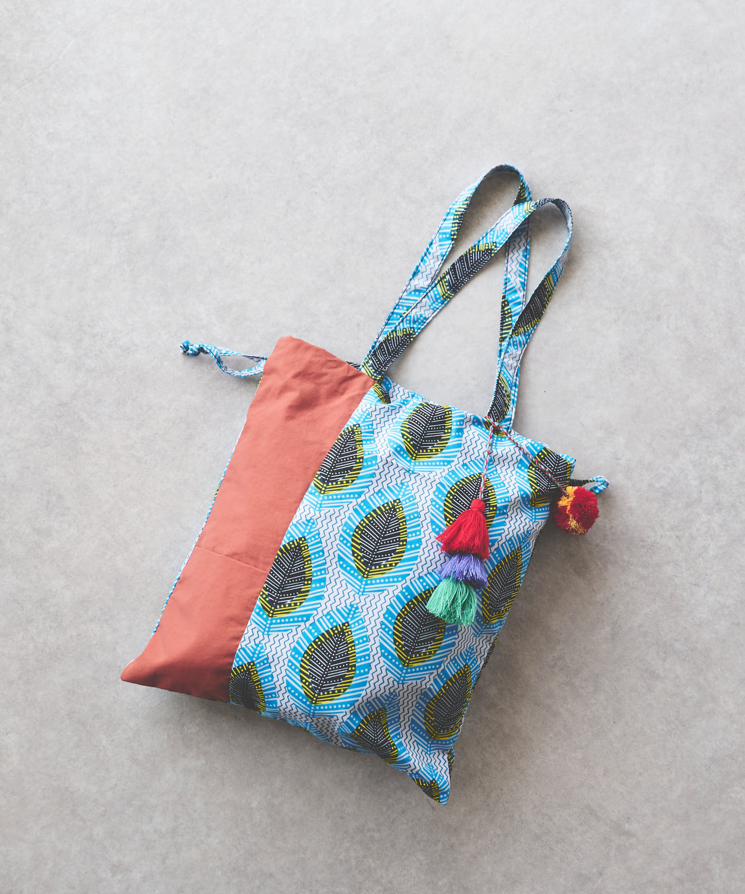 un dix cors(アンディコール) 《予約》アフリカン柄タッセル２WAYバッグ