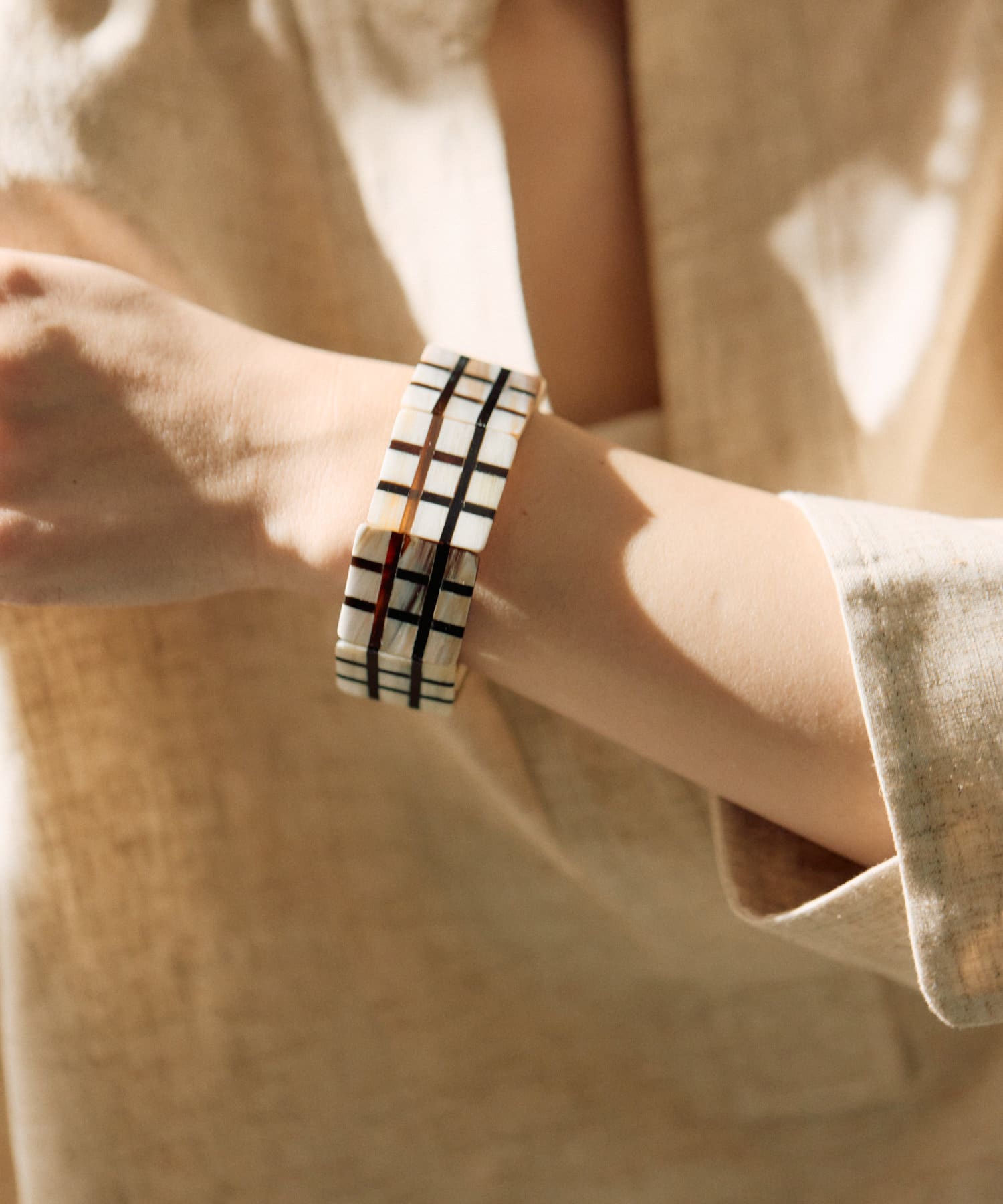 ear PAPILLONNER(イア パピヨネ) 水牛角格子柄ブレスレット