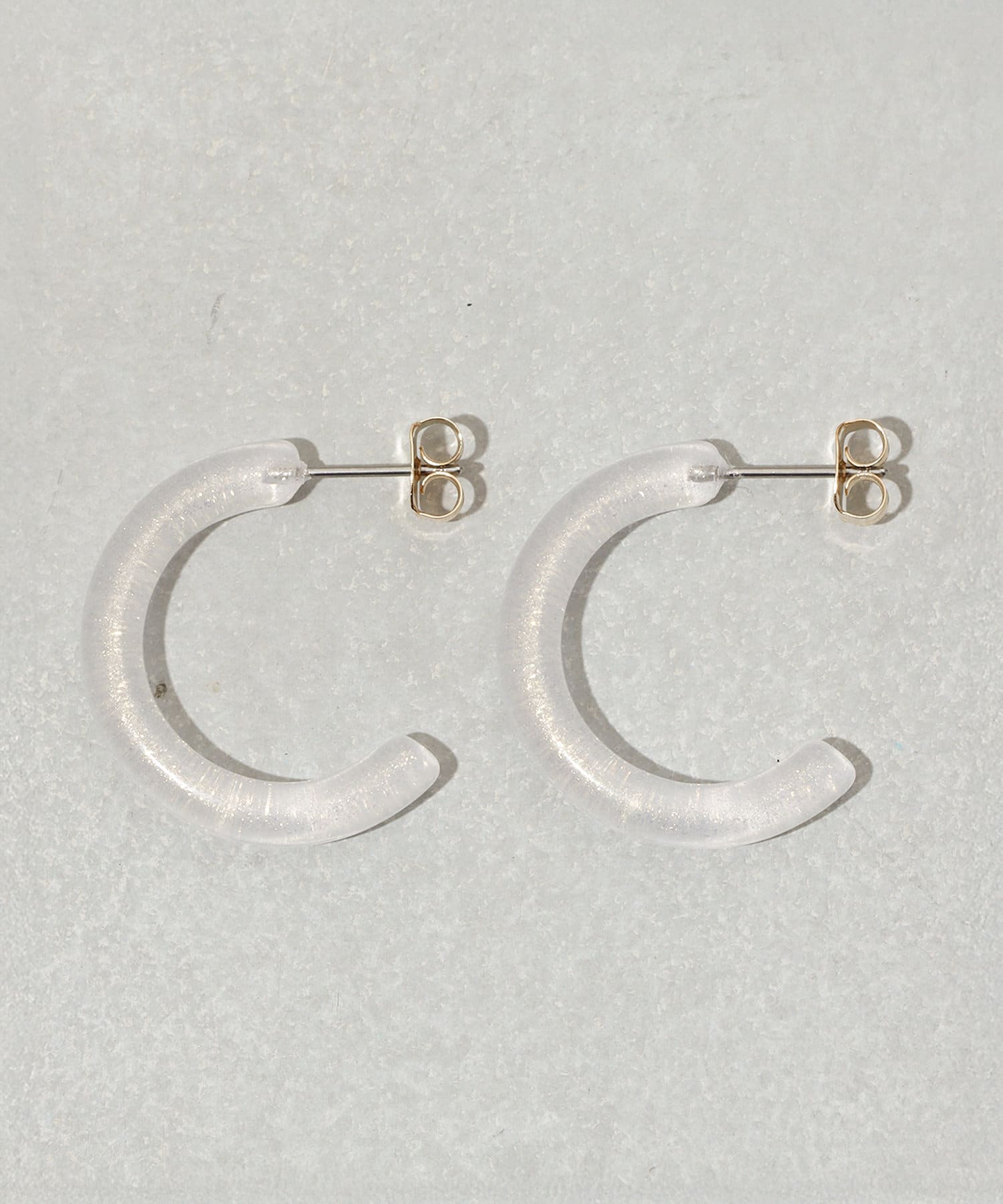 3COINS(スリーコインズ) クリアラメカーブピアス