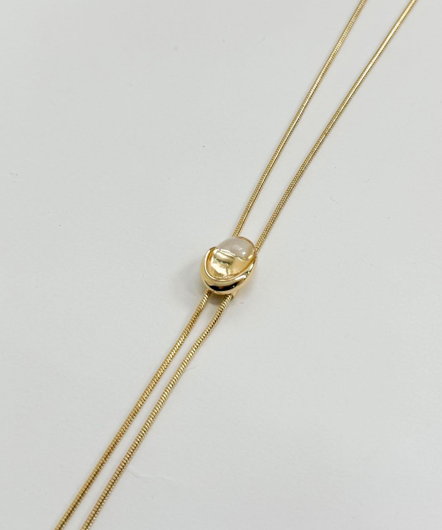 FREDY & GLOSTER(フレディ アンド グロスター) クリアストーンスライドボータイネックレス