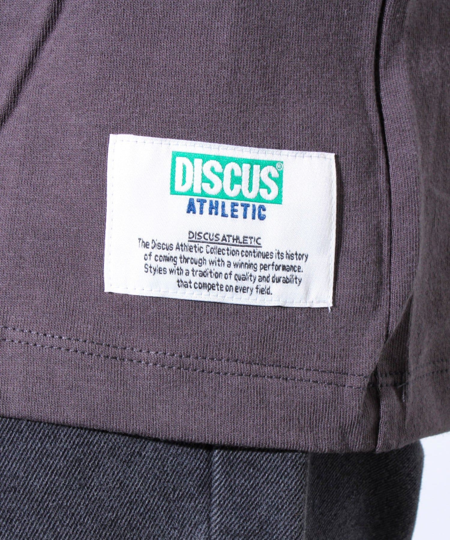 FREDY & GLOSTER(フレディ アンド グロスター) 【WARNER×DISCUS ATHLETIC】コラボ プリント 半袖Tシャツ