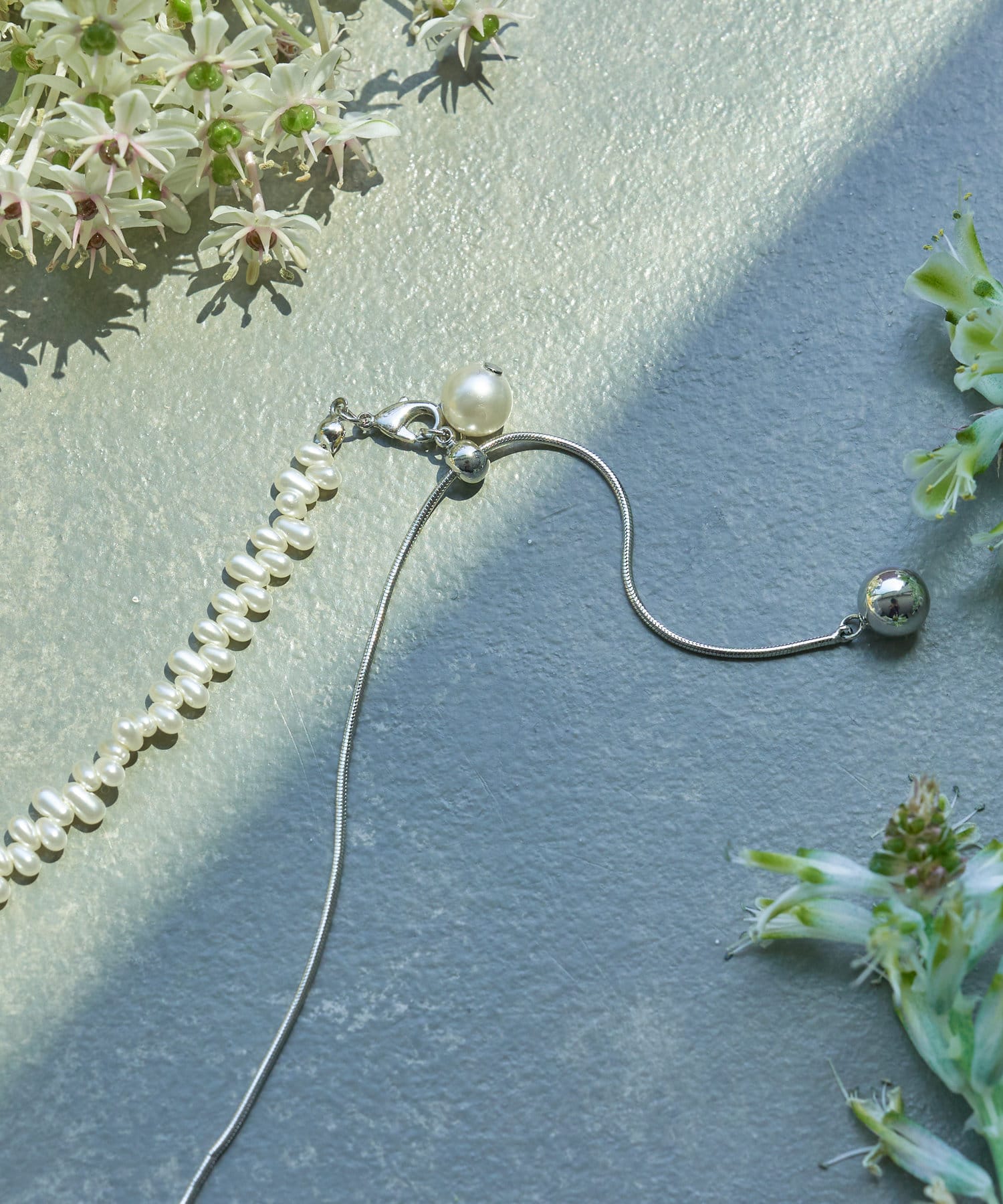 Jena　espace merveilleux(ジェナ　エスパスメルヴェイユ) パールミックススライドネックレス