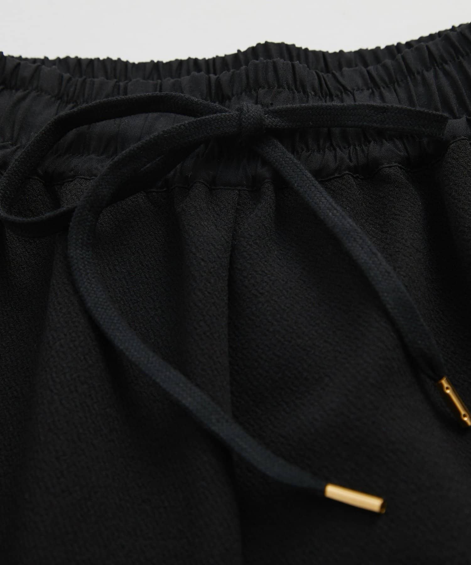 un dix cors(アンディコール) 《オンオフ選ばず活躍》サンディカットジョーゼットカーブパンツ