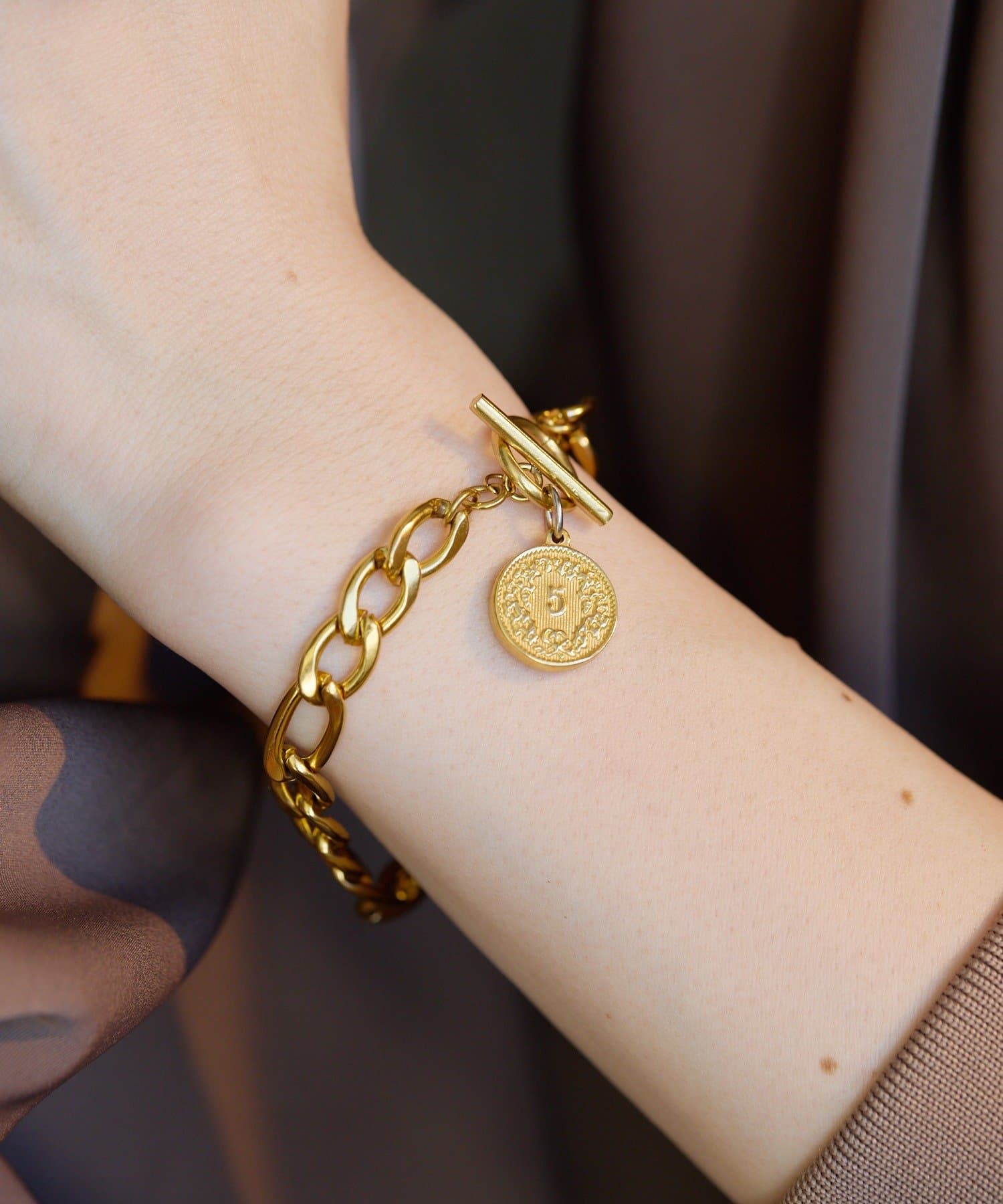 ear PAPILLONNER(イア パピヨネ) 《金属アレルギー対応/ステンレス》コイン付フィガロブレスレット