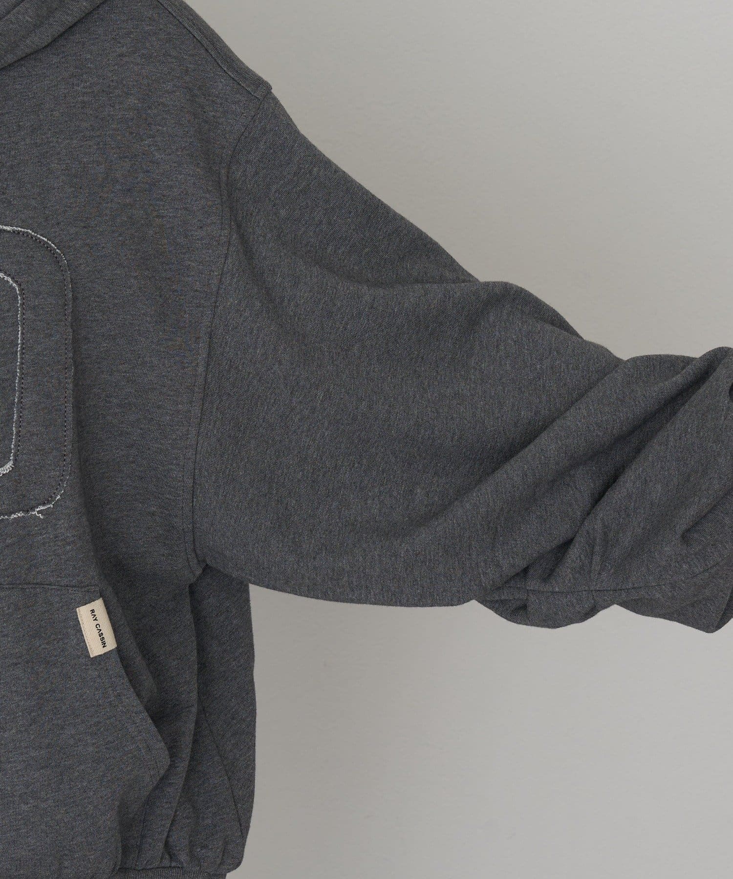 RAY CASSIN(レイカズン) ロゴワッペンフードジップパーカー