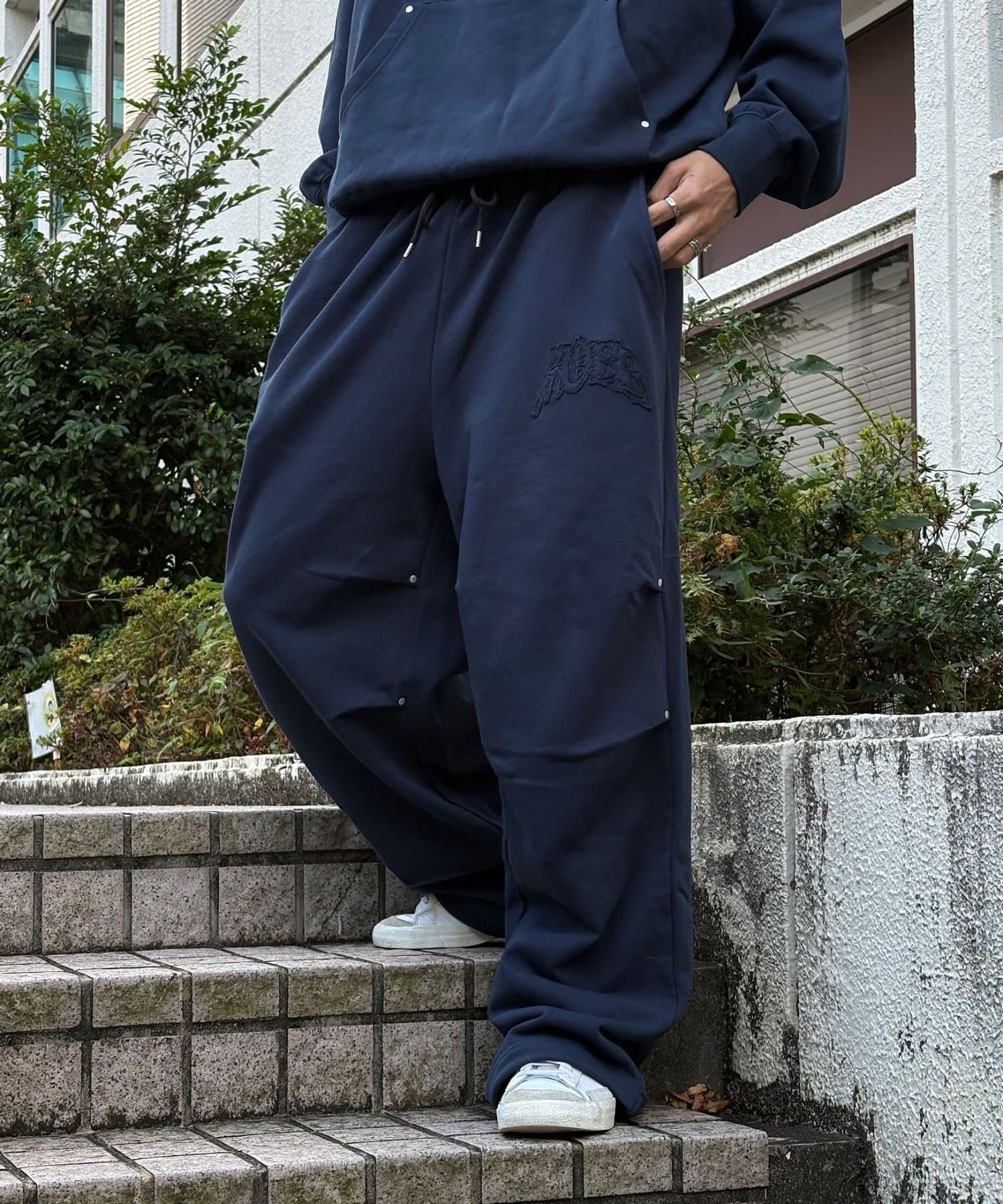 CIAOPANIC(チャオパニック) カットレイヤーロゴスタッズスウェットパンツ