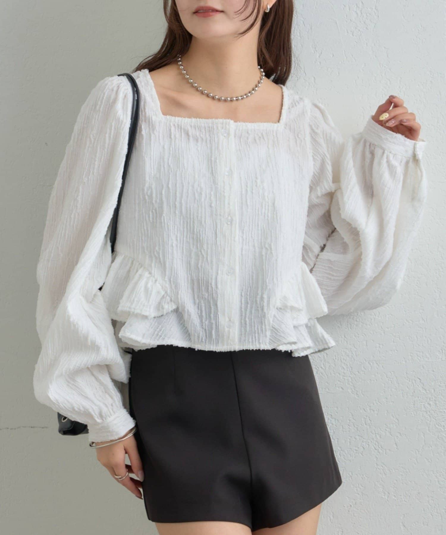 mystic(ミスティック) ジャガード裾フリルブラウス