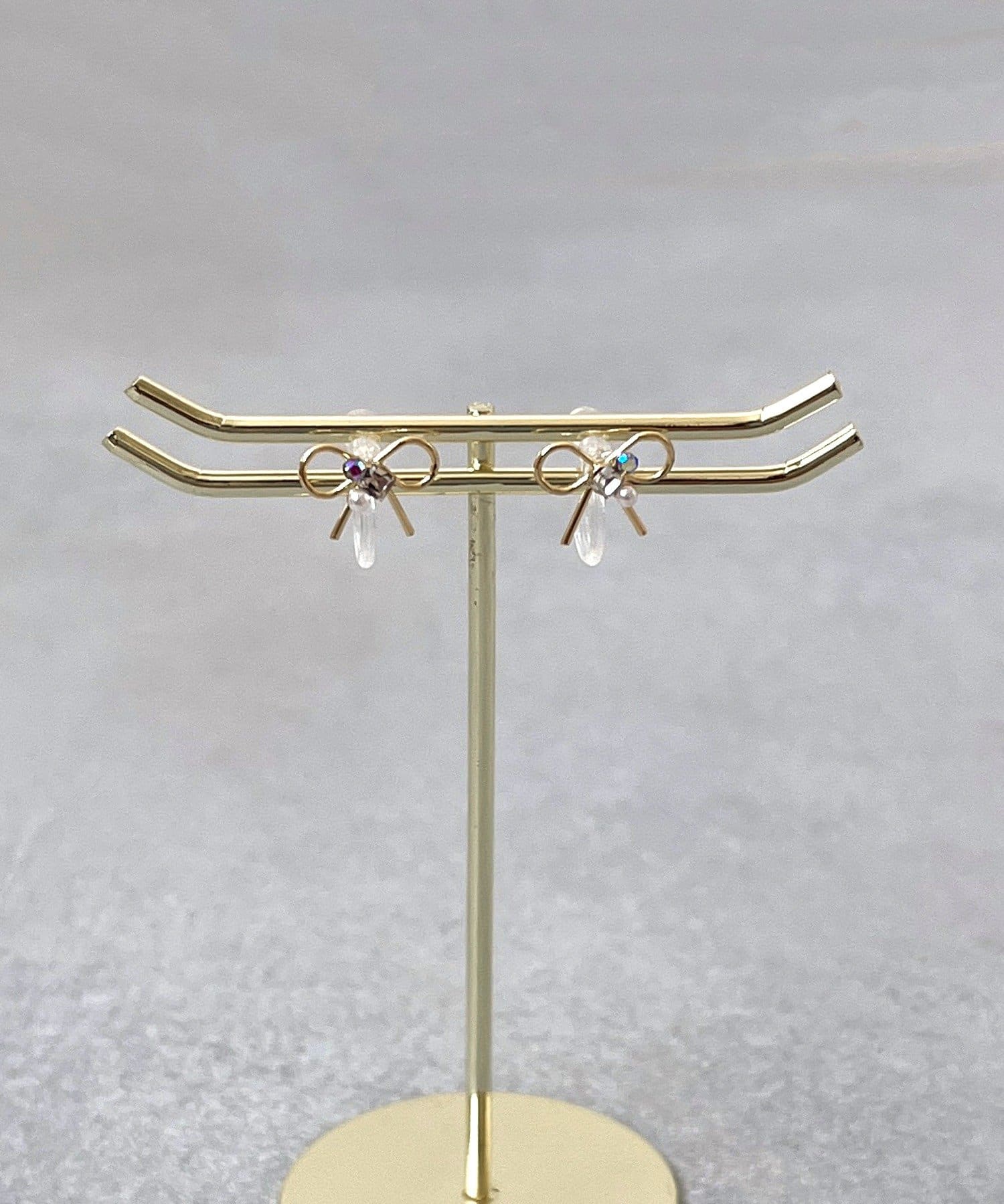 3COINS(スリーコインズ) センターパーツリボン樹脂イヤリング