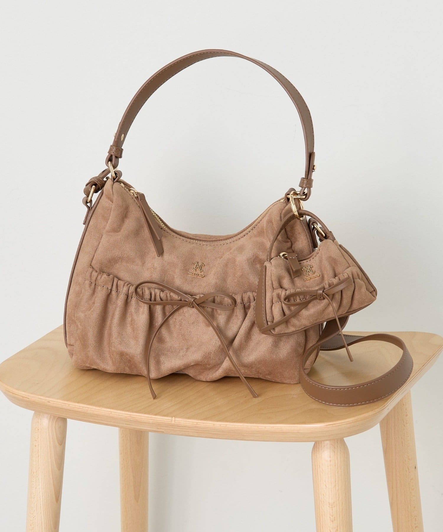 one after another NICE CLAUP(ワンアフターアナザー ナイスクラップ) ミニバッグチャーム付きドロストリボンバッグ