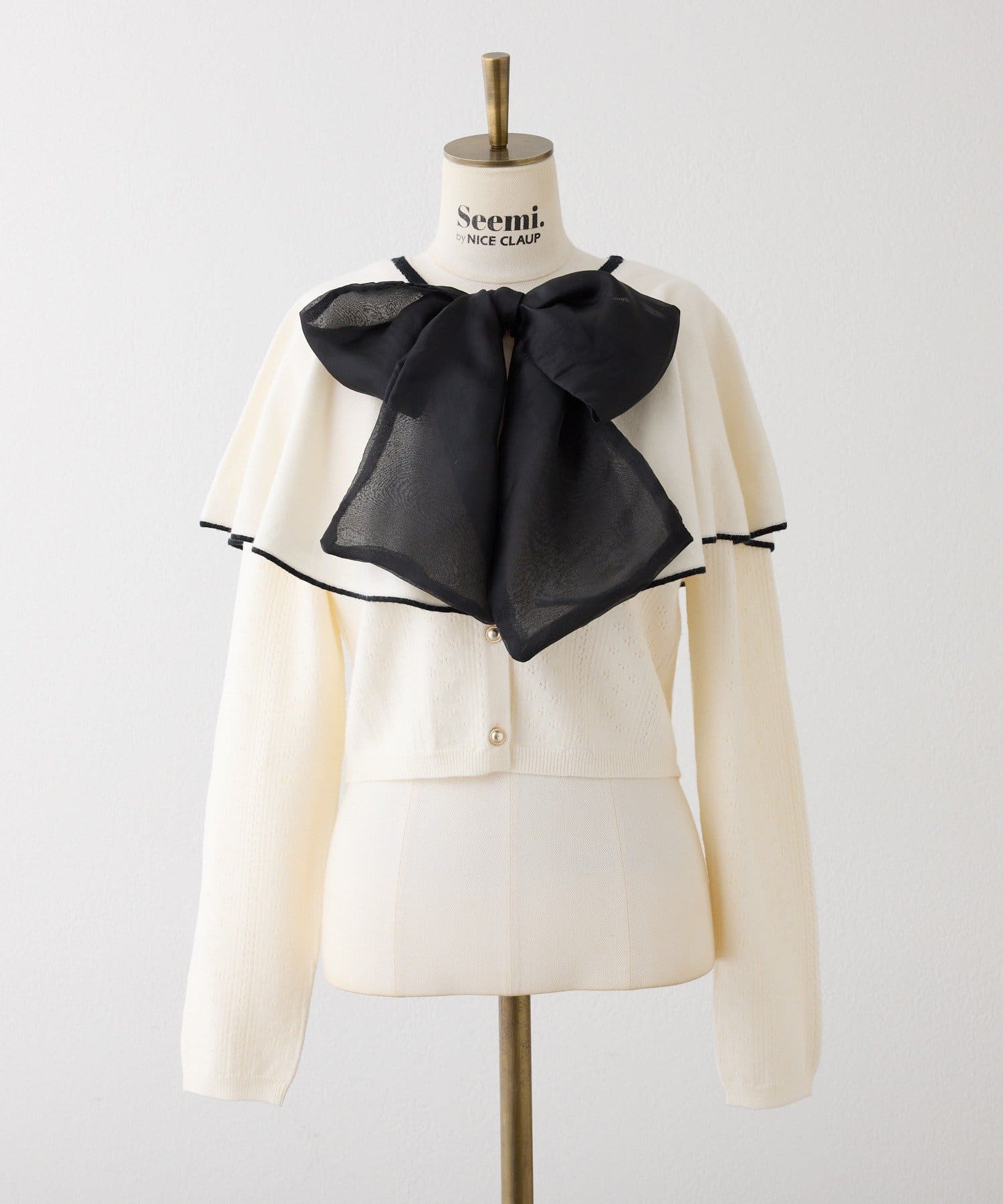 Seemi.by NICE CLAUP(シーミーバイナイスクラップ) 【ケープ取り外し可能】ボウタイアイレットカーディガン