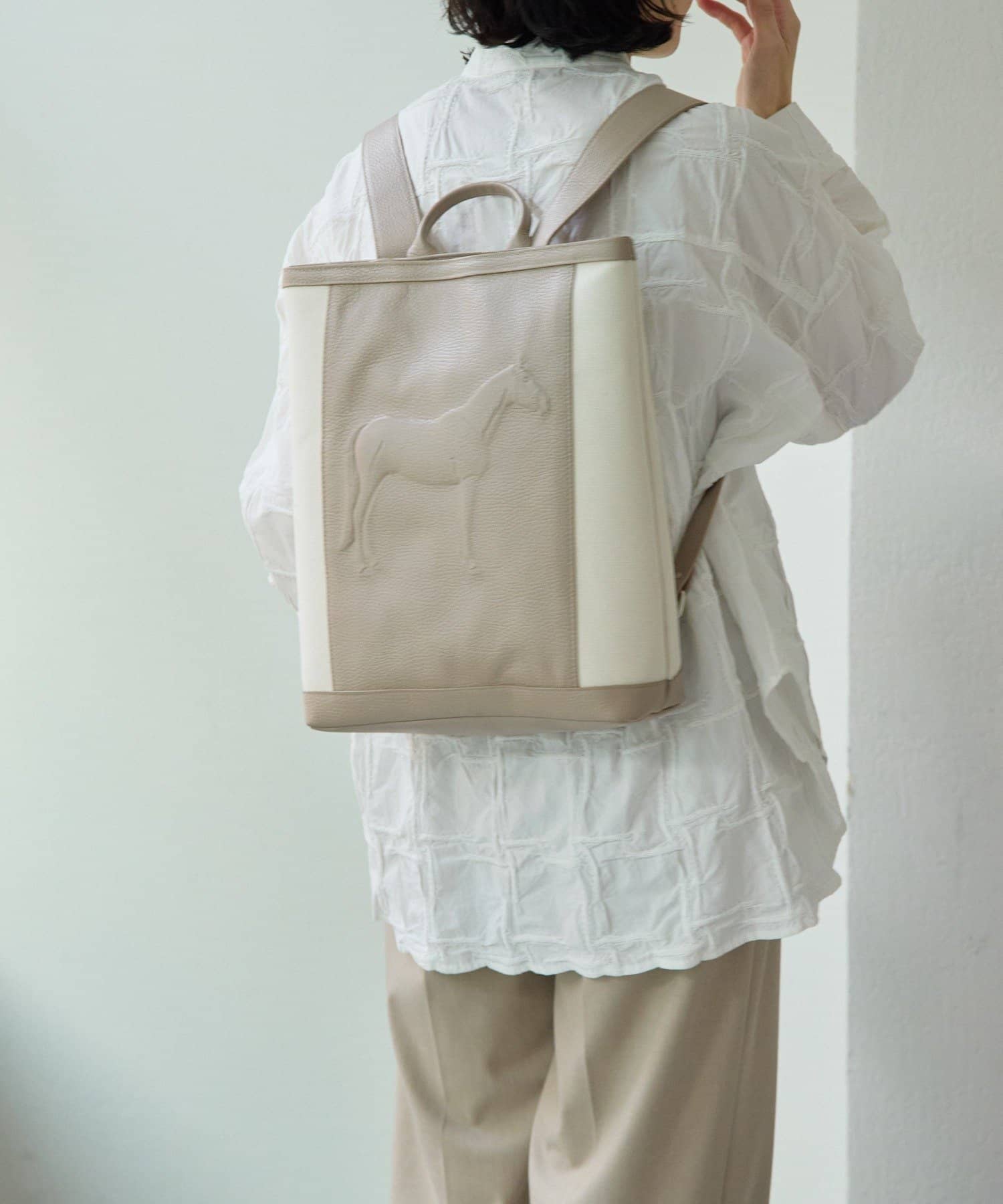 ear PAPILLONNER(イア パピヨネ) 【IOPELLE(イオペレ)】ホーススタンプキャンバスリュック