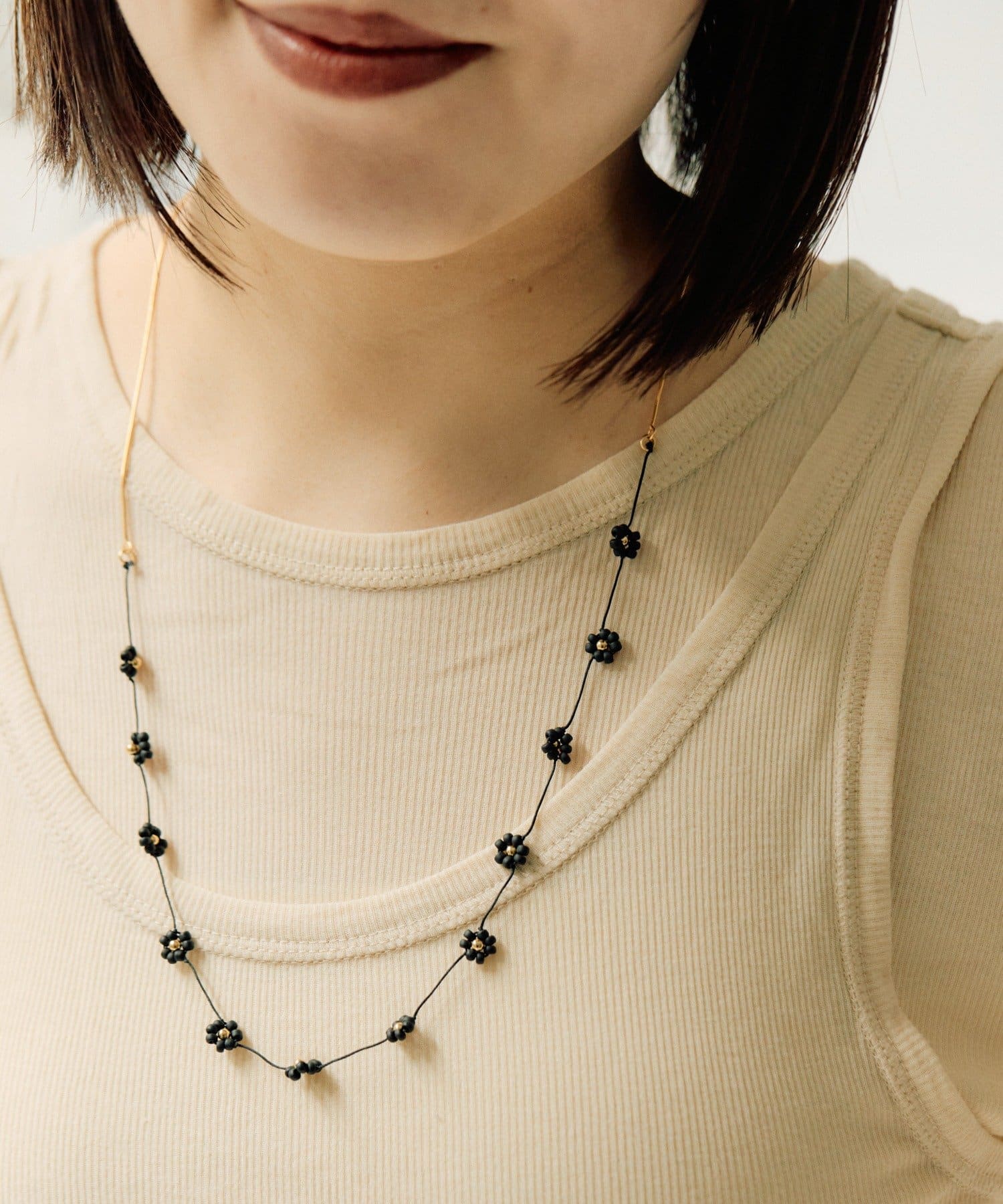 ear PAPILLONNER(イア パピヨネ) ビーズフラワースライドネックレス