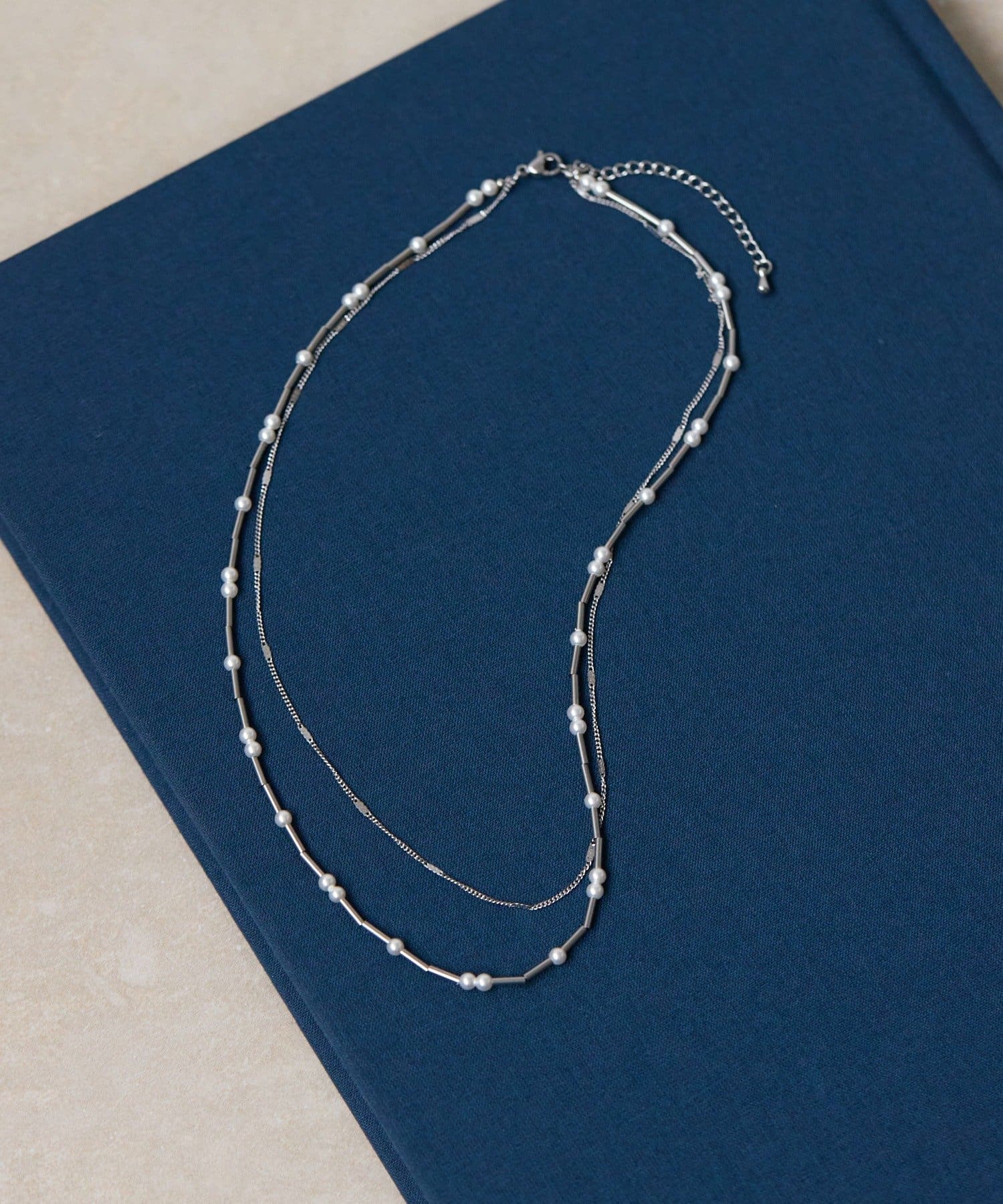 ear PAPILLONNER(イア パピヨネ) 《金属アレルギー対応/ステンレス》2連とばしパールネックレス