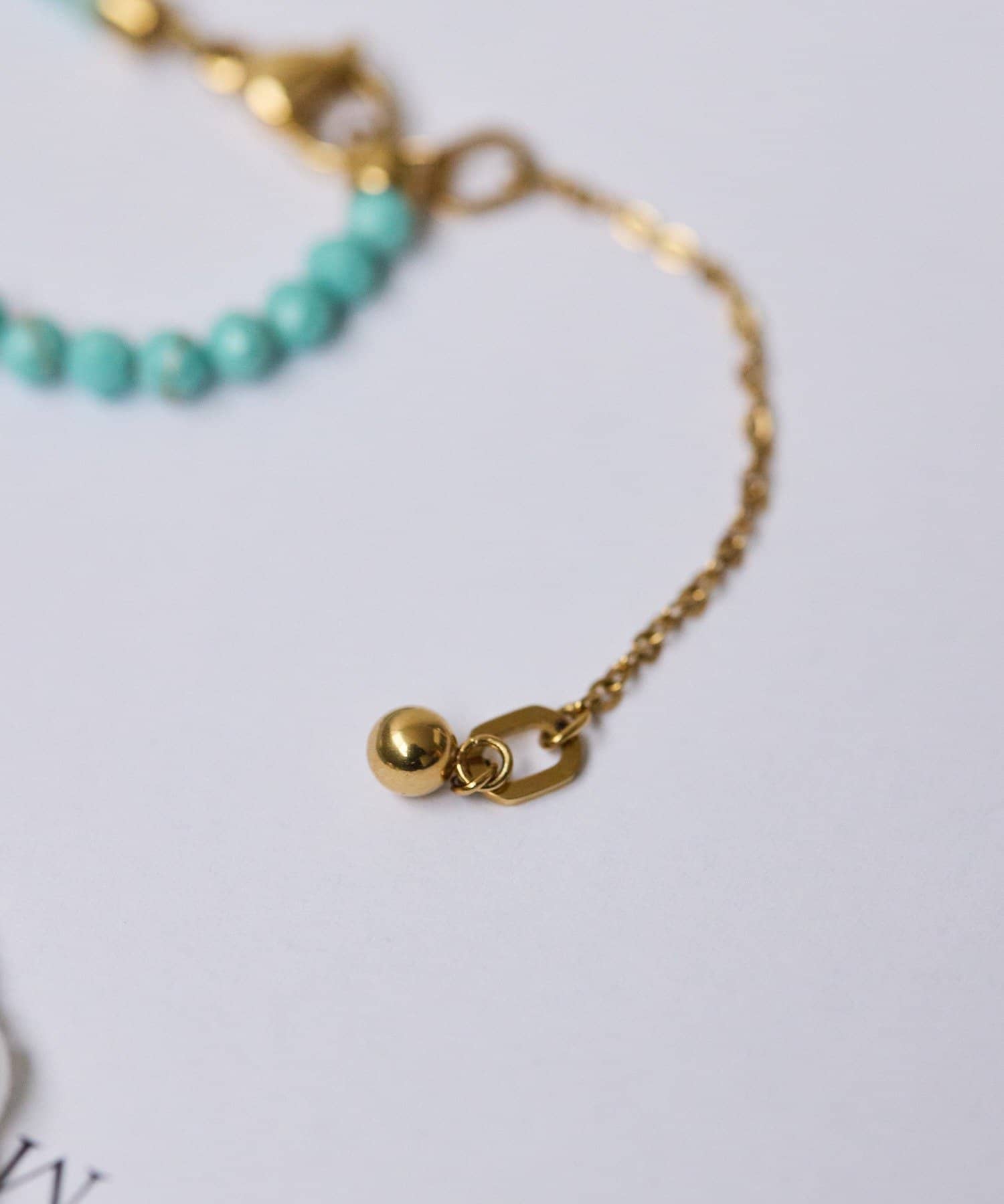 ear PAPILLONNER(イア パピヨネ) 《金属アレルギー対応/ステンレス》ビーズクロスネックレス