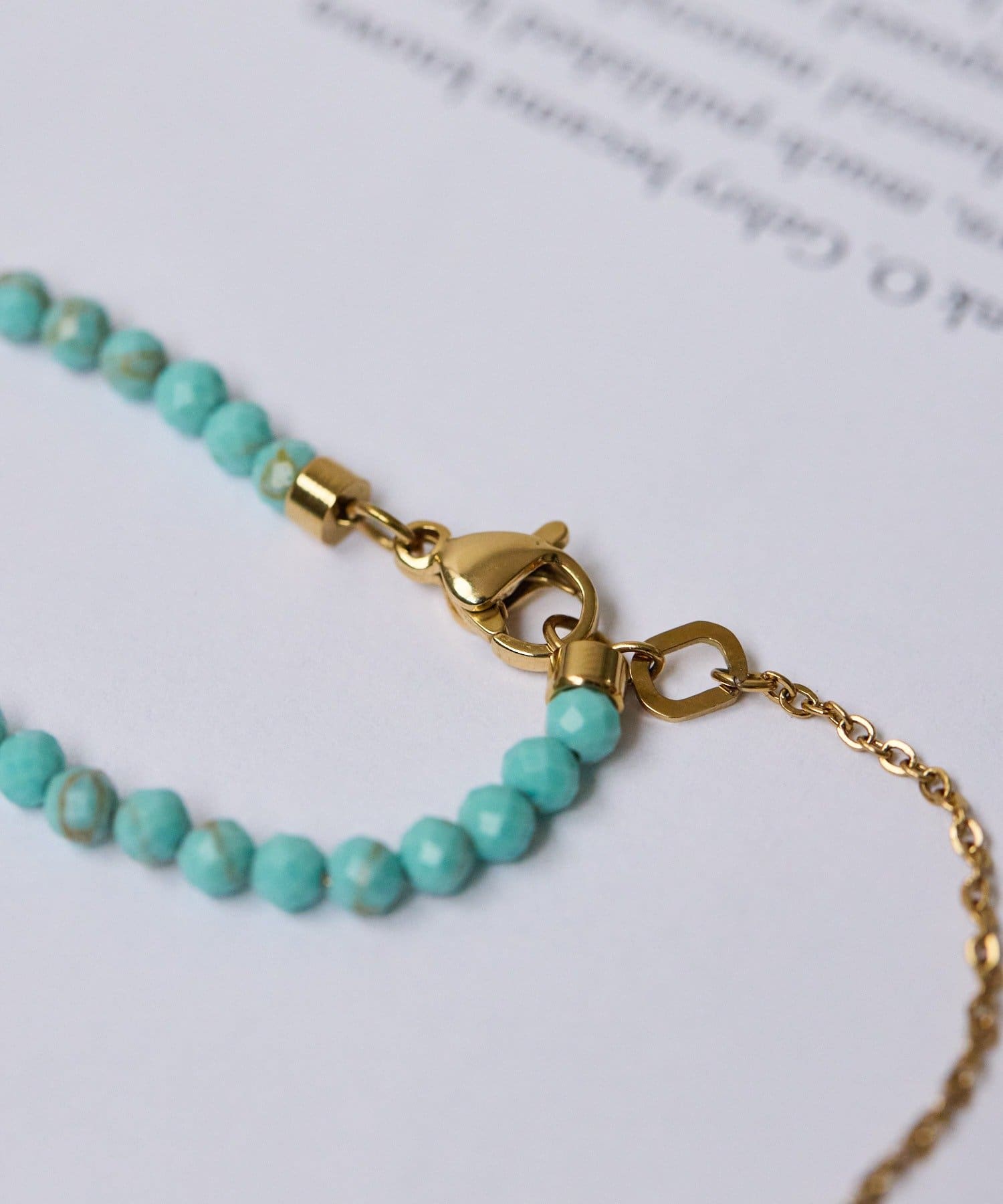 ear PAPILLONNER(イア パピヨネ) 《金属アレルギー対応/ステンレス》ビーズクロスネックレス