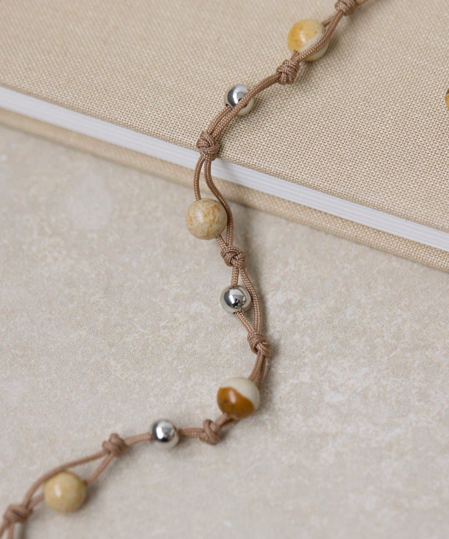 ear PAPILLONNER(イア パピヨネ) ロープ編みビーズネックレス