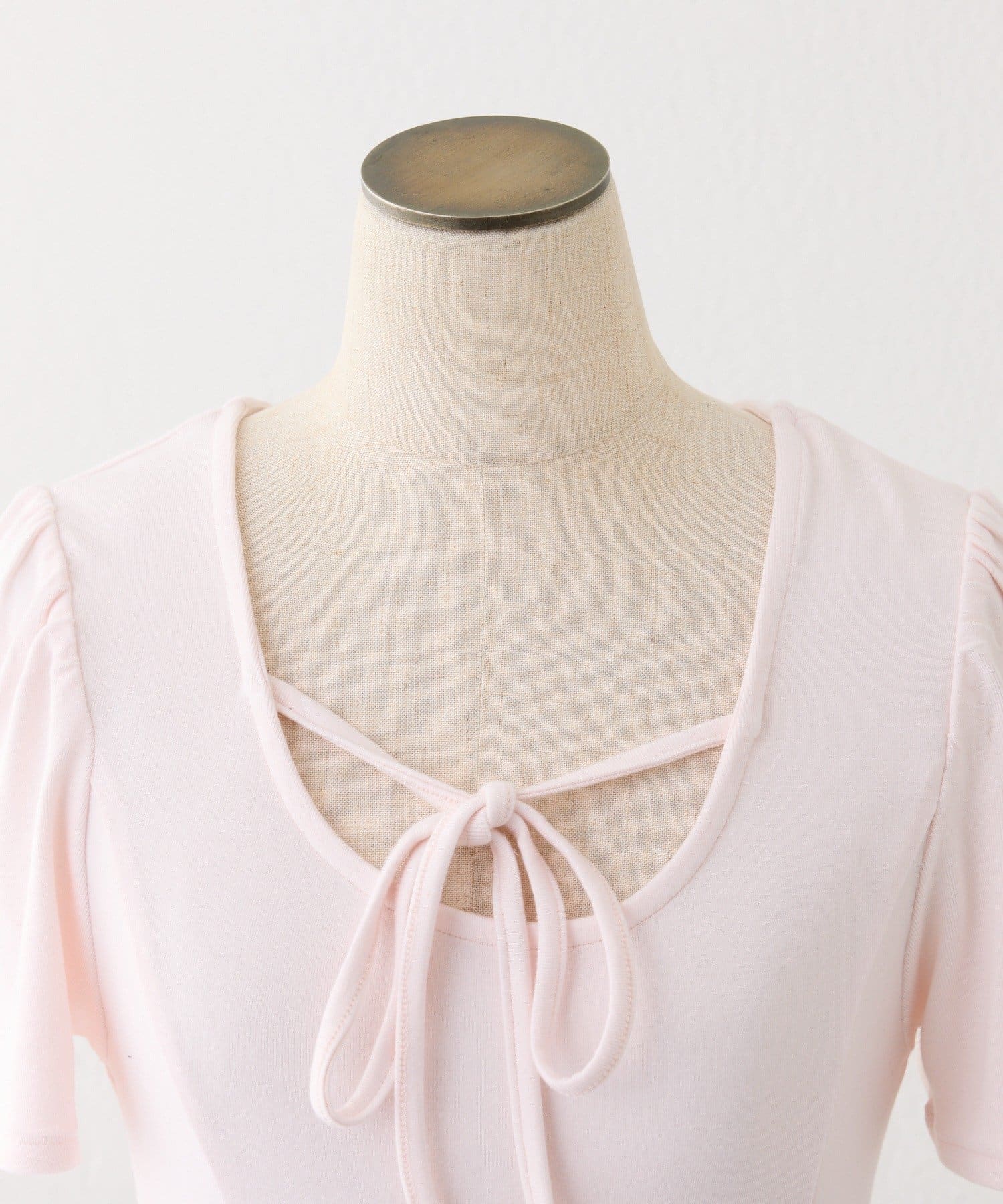 one after another NICE CLAUP(ワンアフターアナザー ナイスクラップ) リボン付き裾フリルトップス