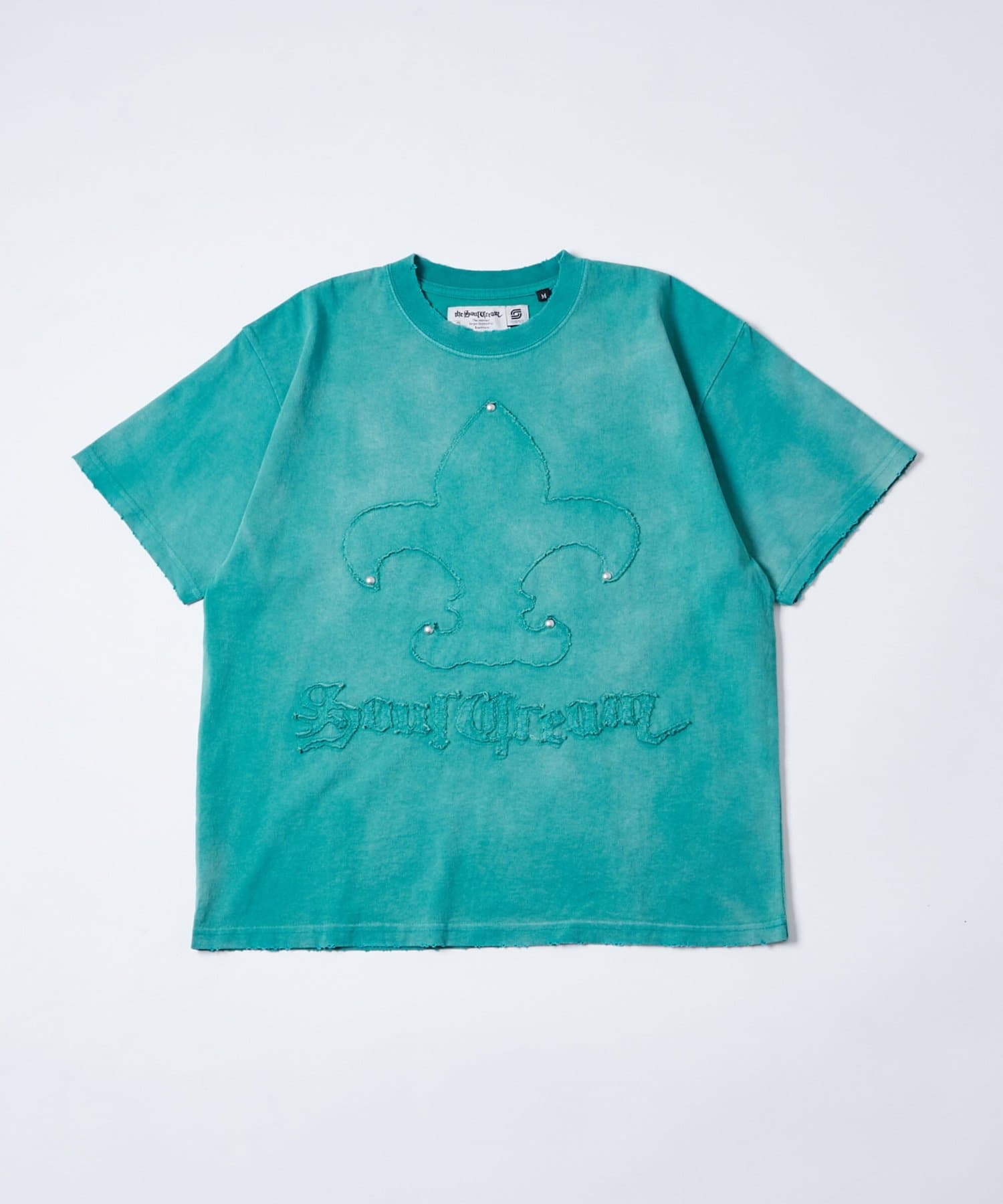 WHO’S WHO gallery(フーズフーギャラリー) Sourcreamユリ紋章貼り付けTEE