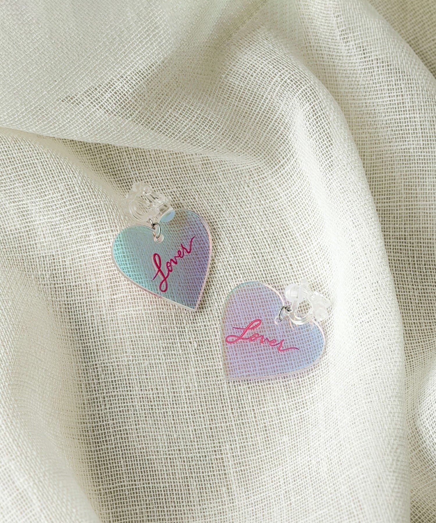 3COINS(スリーコインズ) クリアハートイヤリング／KIDS