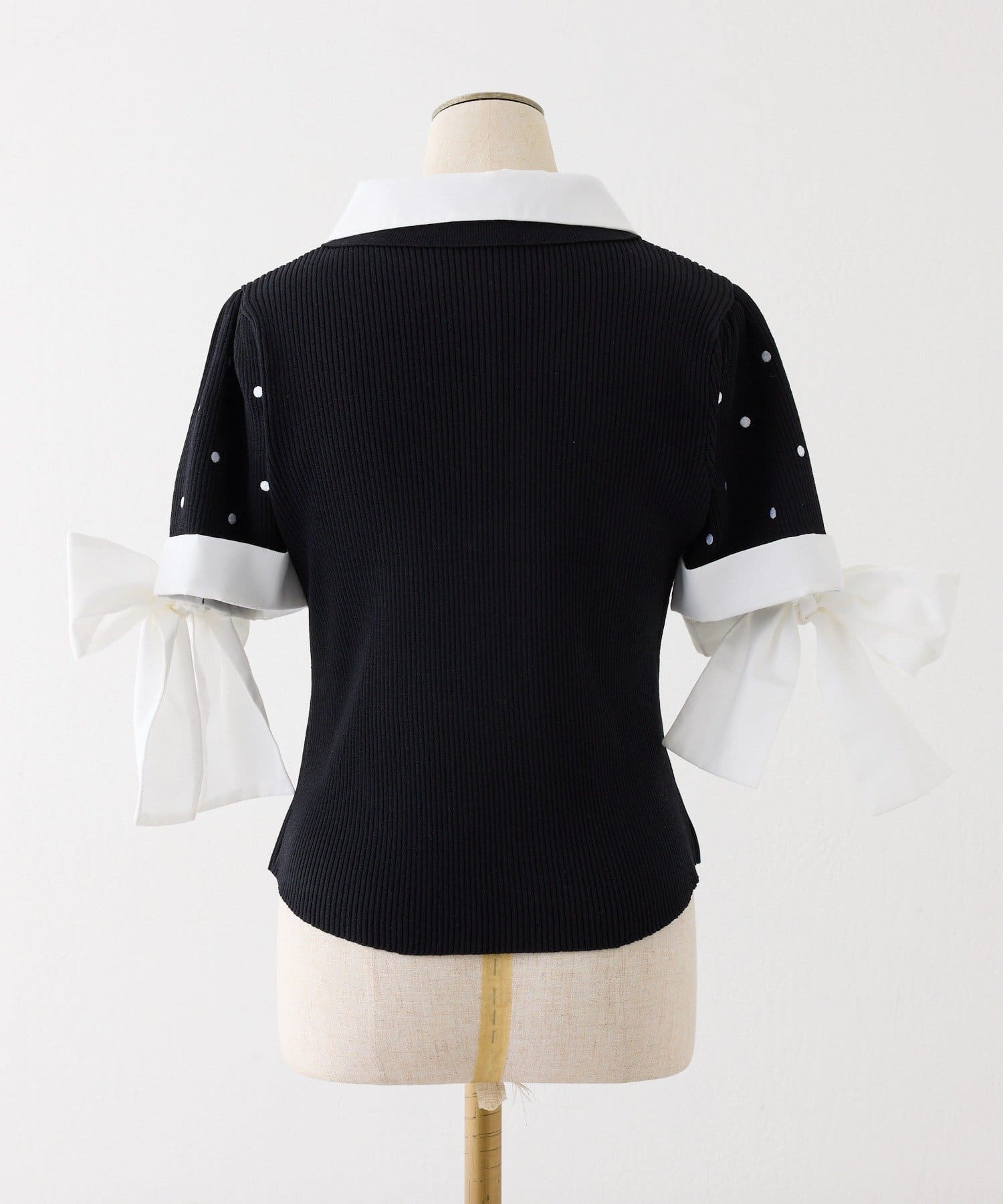one after another NICE CLAUP(ワンアフターアナザー ナイスクラップ) 袖リボンシャツドッキング刺繍入りニット